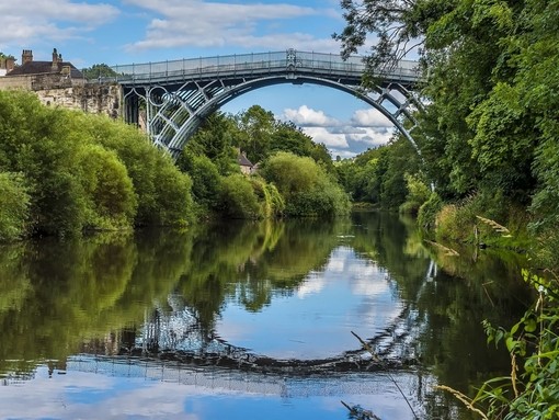 A lovely iron arched bridge over a pretty river