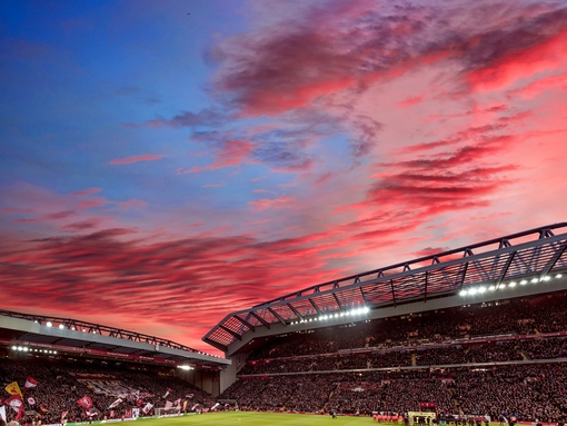 Red clouds in sunset over the ground of a stadium