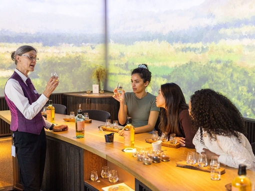 Three women having a tasting session at a whisky distillery