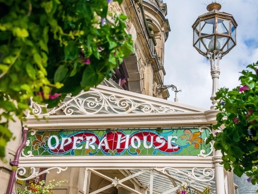 The stained glass signage on the front of Buxton Opera House, Derbyshire, UK