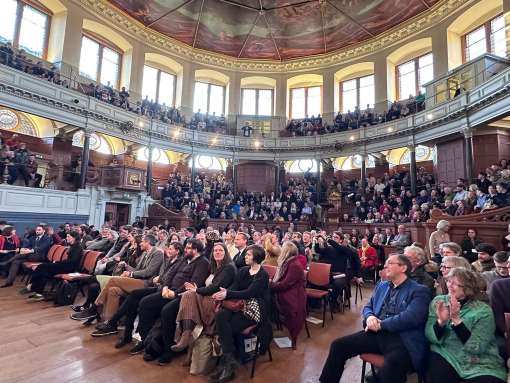 Crowds of people watching a talk on stage at Oxford Literary Festival