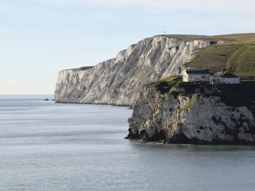 Houses on chalk cliffs overlooking the ocean