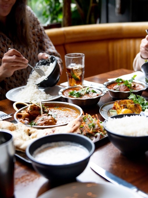 A group of people eating a meal at a table in a restaurant in Birmingham, West Midlands
