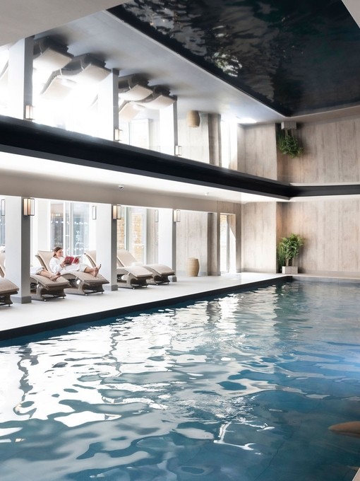 A woman relaxing inside a spa area.